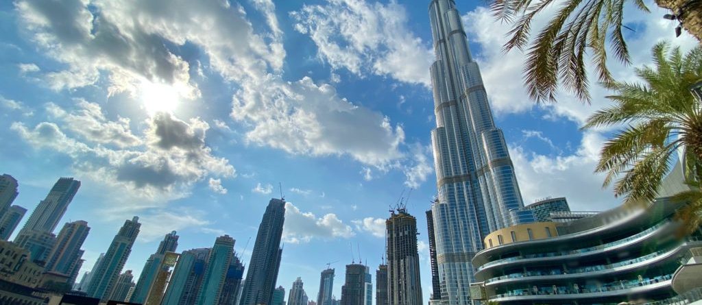 Dubai skyline with Burj Khalifa and palm trees