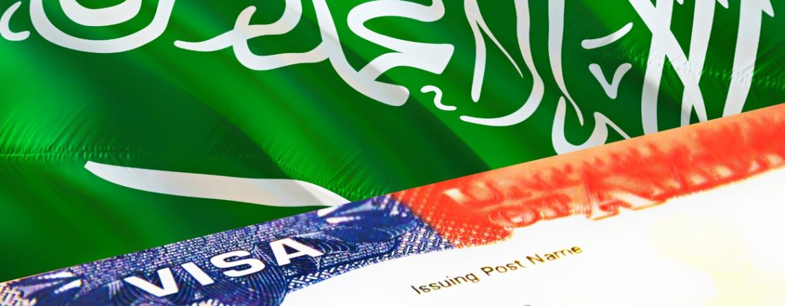 Saudi Arabian flag with a visa document in the foreground.