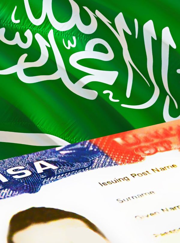 Saudi Arabian flag with a visa document in the foreground.