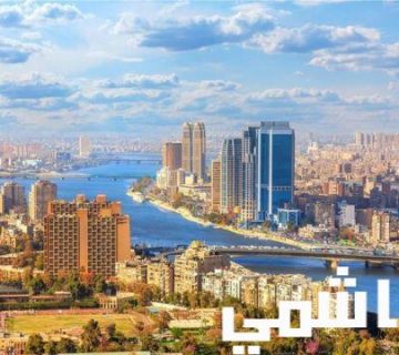 Cairo cityscape with Nile River and modern buildings.