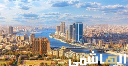 Cairo cityscape with Nile River and modern buildings.