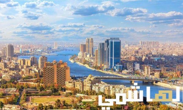 Cairo cityscape with Nile River and modern buildings.