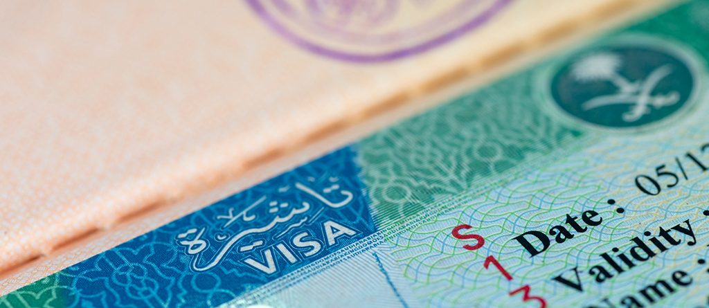 Close-up of Saudi Arabia visa stamp on a passport page.
